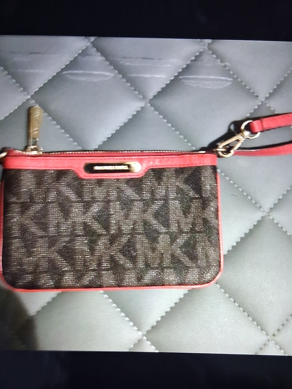 Michael Kors Brown Monogram Wristlet with Red Trim